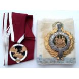 A Loyal Order of Moose masonic medal with maroon ribbon, together with an Ancient Order of Foresters