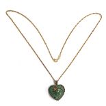 A 9ct gold pendant in the form of an agate heart mounted in a floral cage, on a 9ct gold chain,