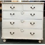 A white painted pine chest, with two short over three long drawers, on bun feet, 96x46x93cmH