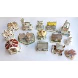 A lot of fourteen various Coalport ceramic cottages to include The Coaching Inn, Clock Tower,