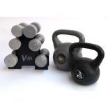 Three pairs of dumb bells in a V-fit stand, a further 5kg dumb bell together with an 8kg kettle bell