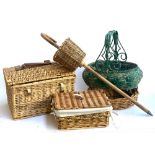 A number of wicker baskets, together with a foraging stick