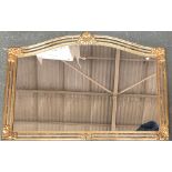 A large modern gilt framed mirror, the frame inset with mirrored plates, 89x129cm, together with