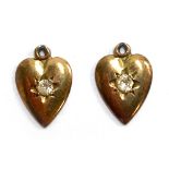 A pair of 9ct gold heart earrings set with white stones (missing studs), approx. 1.3g