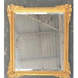 A small rectangular mirror with bevelled glass, in gilt gesso picture frame, 46x41cm