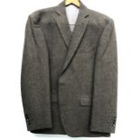 An Austin Reed brown herringbone wool jacket, 46R, with jacket cover