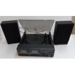 A Bush dual cassette audio system with dual speed turntable and speakers