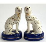 A pair of Staffordshire dogs with spot decoration, heightened in gilt, 13.5cmH