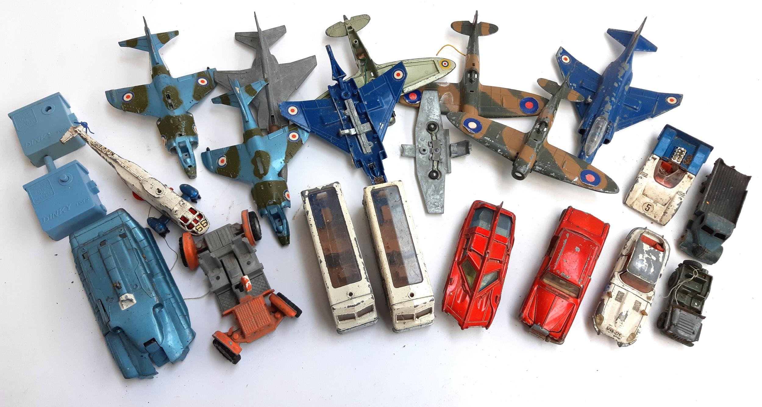 A quantity of Dinky die cast vehicles and planes to include Harrier, Sea King, Spitfire Mk II, Lunar