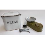 An enamel bread bin, together with a garlic crusher, scone cutter and vintage kitchen scales