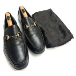 A pair of black leather Gucci driving shoes, size 11, with trees and Gucci bag