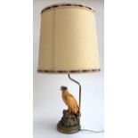 A resin table lamp in the form of an eagle, signed I. Giannelli '73, 69.5cmH to top of shade