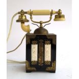 A vintage rotary telephone in the form of a black lacquered Chinese tabletop cabinet, 30cmH