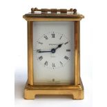 A Bayard eight day brass carriage clock, with enamel dial, Roman numerals, bevelled glass plates,