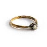 An 18ct gold and diamond ring, size M 1/2, approx. 1.6g