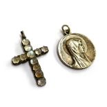 A silver and moonstone crucifix, 3.5cmL; together with a white metal religious medal