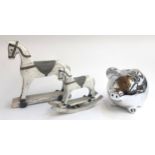 Two resin rocking horse figures, together with a large piggy bank, 19cmH