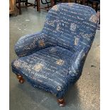 A 19th century low armchair with serpentine seat and turned legs, 73cmW