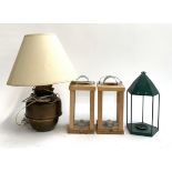 A pair of modern candle lanterns, a brass oil lamp (converted) and one other