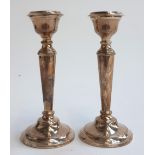 A pair of silver candlesticks with removable bobeches, Birmingham, Cohen & Charles, 1963, each 15.