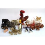 A mixed lot of animal figurines to include elephants, Staffordshire style cats camels, USSR penguin,