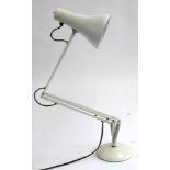 A white angle poise lamp