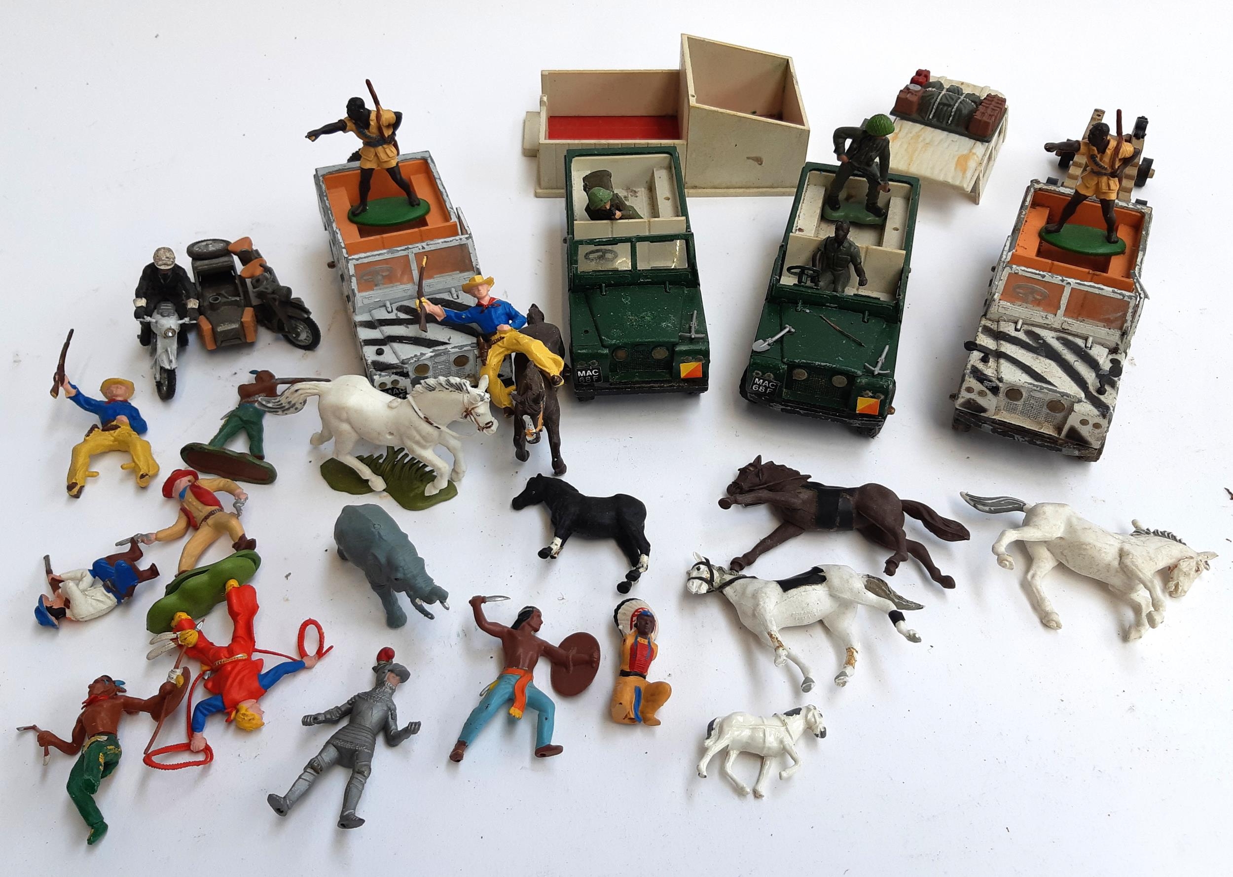 A quantity of Britains vehicles and animals to include 2 safari L.W.B Land Rovers, 2 further L.W.B