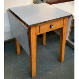 A 1950s formica topped dropleaf table, single canteen drawer, on square tapered legs, 58x61x67cmH,