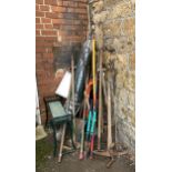 A large quantity of long handled garden tools