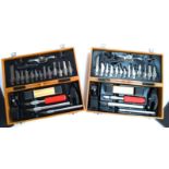 Two new and cased sets of lino cutting equipment