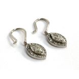 A pair of platinum and marquise cut diamond earrings, the marquise diamonds approx. 10x4mm,