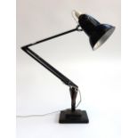 A Herbert Terry angle poise lamp on stepped plinth base