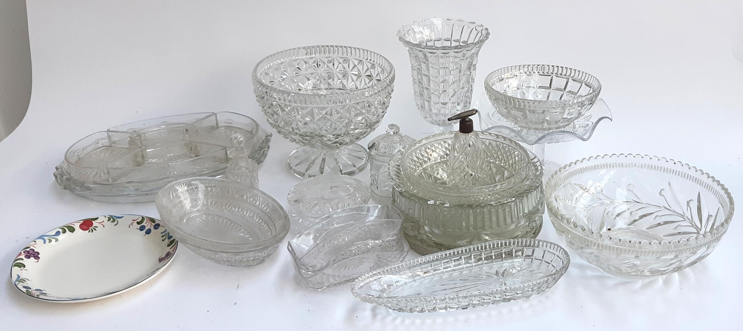 A large quantity of cut glass items to include fruit bowls, vase, jam pot, trinket pot, bottle,