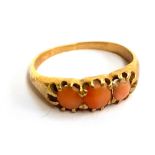 A gold and coral ring, tests as 18ct or higher, approx. 3.3g, size O 1/2