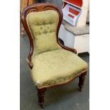 A Victorian mahogany balloon back upholstered salon chair, serpentine seat on turned legs and