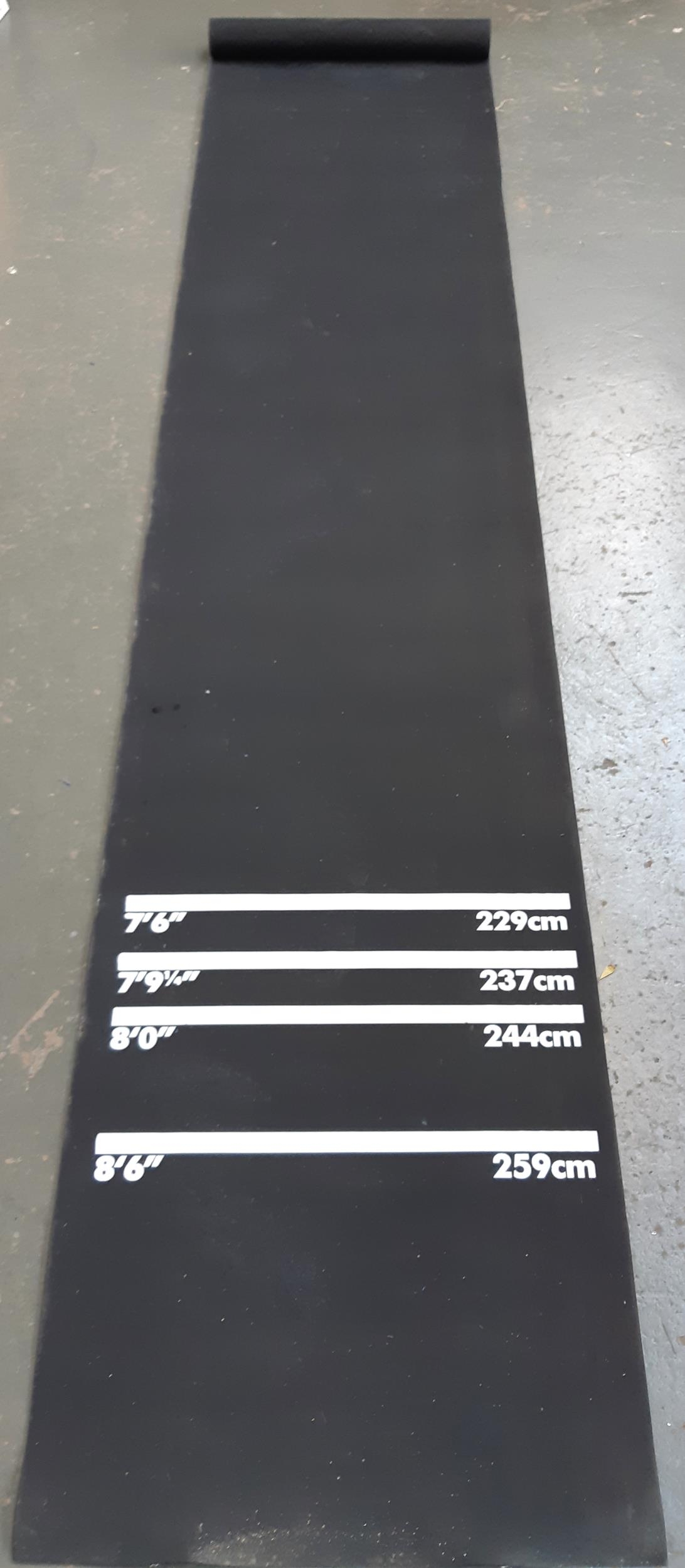 A rubber darts mat with 4 measurements from 7ft 6in to 8ft 6in