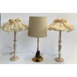 A pair of turned beech table lamps, together with one other gilt metal table lamp, 58cmH to top of