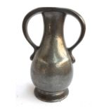 A Liberty Tudric pewter vase with twin handles, incised '01224' to base. 24.5cmH