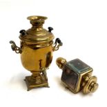 A brass samavar with turned handles, together with a brass carriage lamp with bevelled glass and