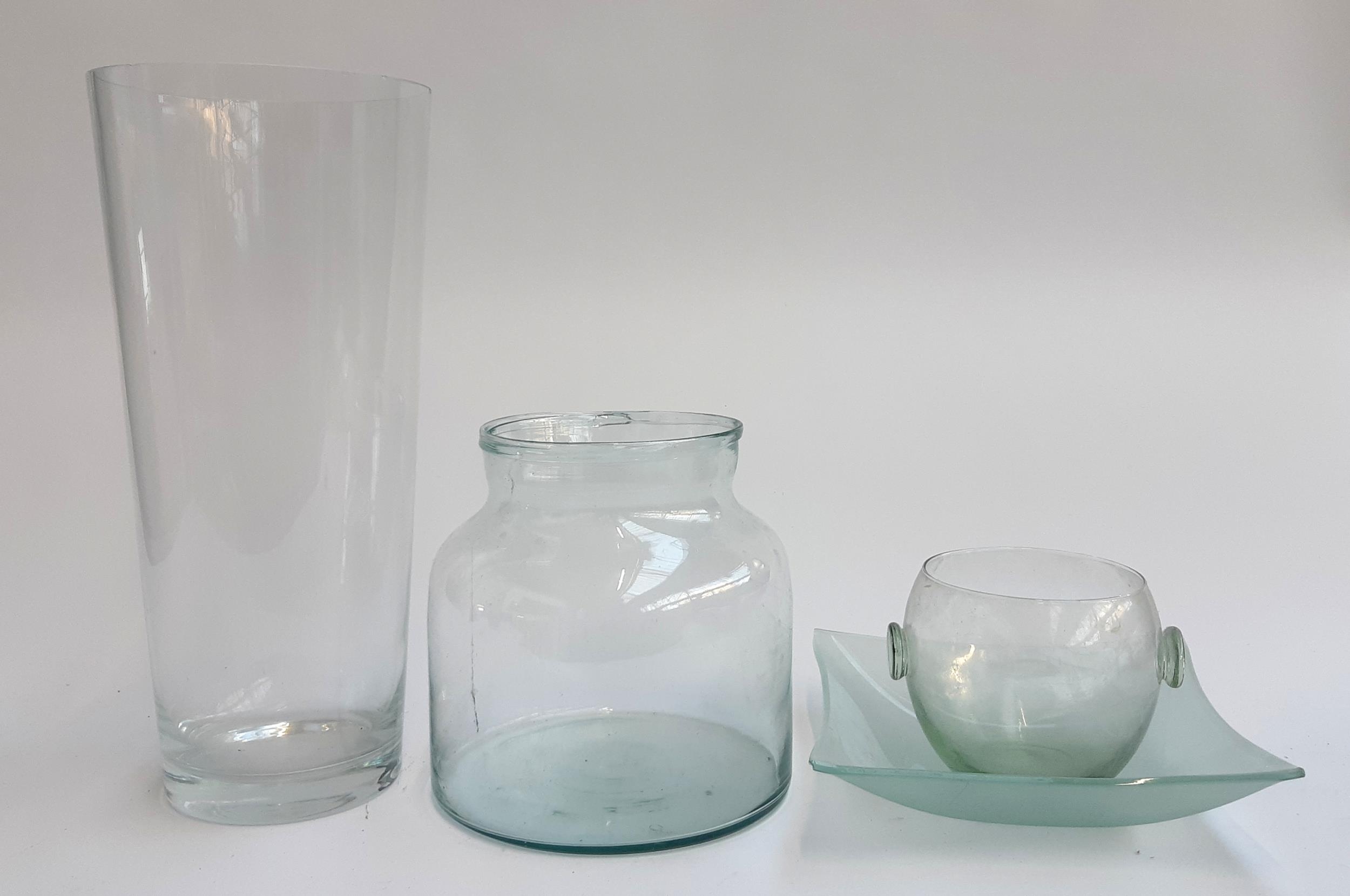 A large glass vase, 40cmH, together with a square glass dish, and two other glass vases