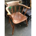 A beech and elm smokers bow chair on turned legs and double H stretcher