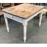 A Victorian pine kitchen table, four plank top on a white painted base, single end drawer and turned