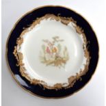A Sevres style cabinet plate with hand painted exotic bird scene to centre, heightened in