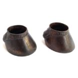 A pair of bronze paperweights in the form of horse hooves, 4cmH