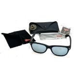 A pair Ray-Ban Wayfarer sunglasses, matte black with tinted lenses, with case and accessories