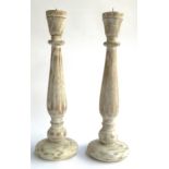 A pair of large wooden candlesticks, each 45.5cmH