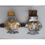 Two AA car badges serial numbers 9A28463 and 4E02219