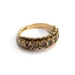 An ornate 9ct gold half eternity band set with white stones, approx. 2.7g, size L