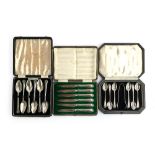 A cased set of six silver handled fruit knives by Mappin & Webb; together with two plated cased sets