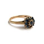 A 9ct gold and sapphire floral cluster ring (one stone missing), approx. 2.5g, size M